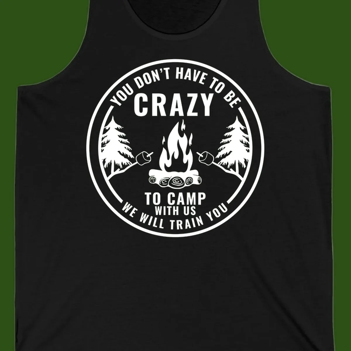 Circular badge design with campfire, pine trees, and marshmallows on sticks with humorous camping text about training crazy campers