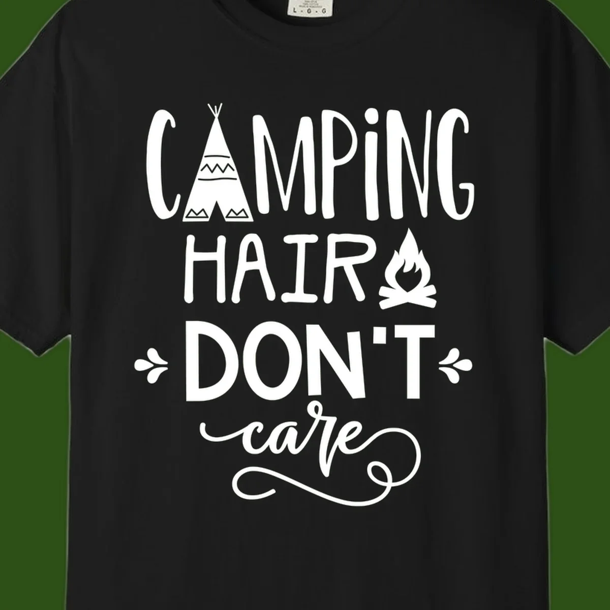 Camping hair don't care design with teepee, campfire, and decorative leaves on gray background