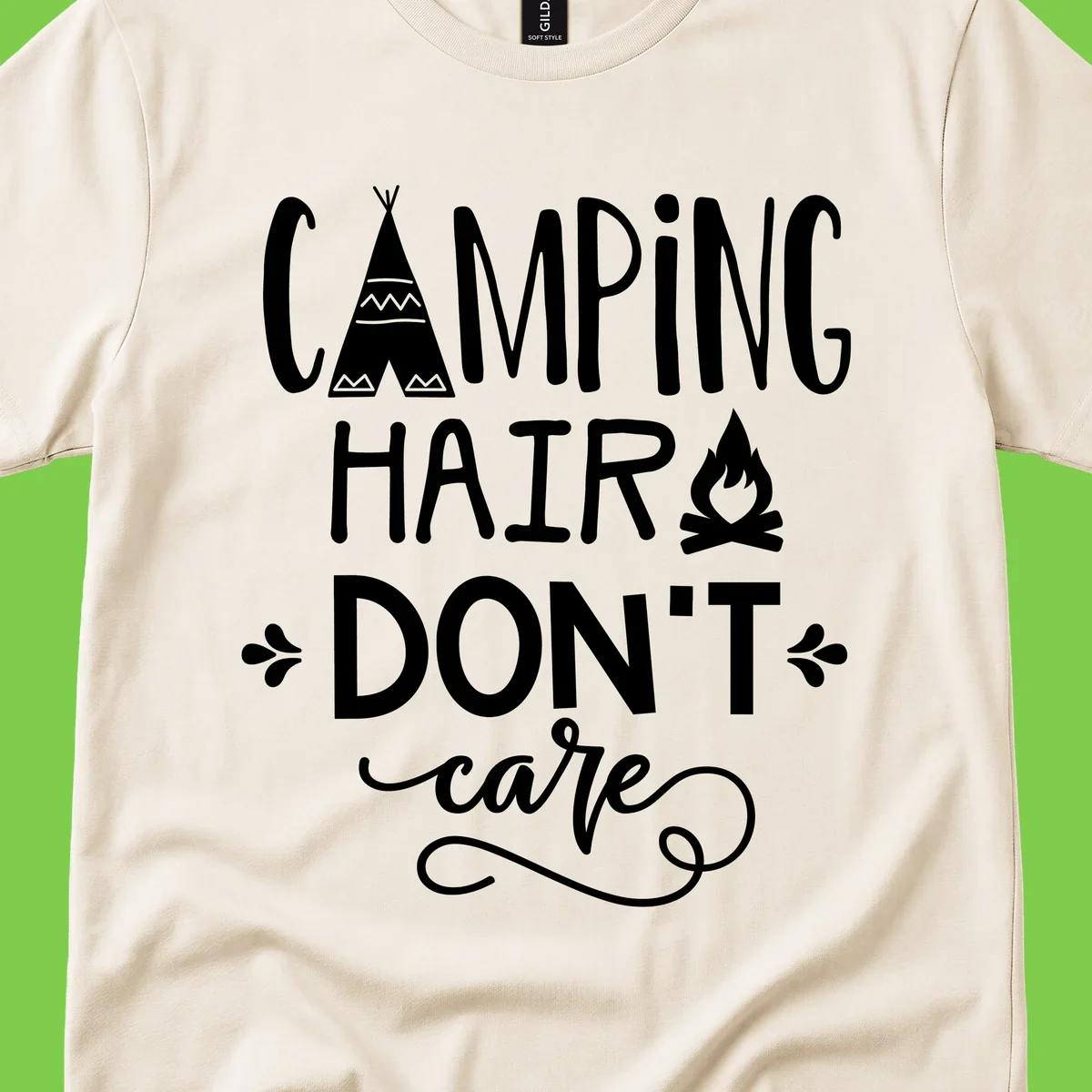Camping hair don't care design with teepee, campfire, and decorative leaves on gray background