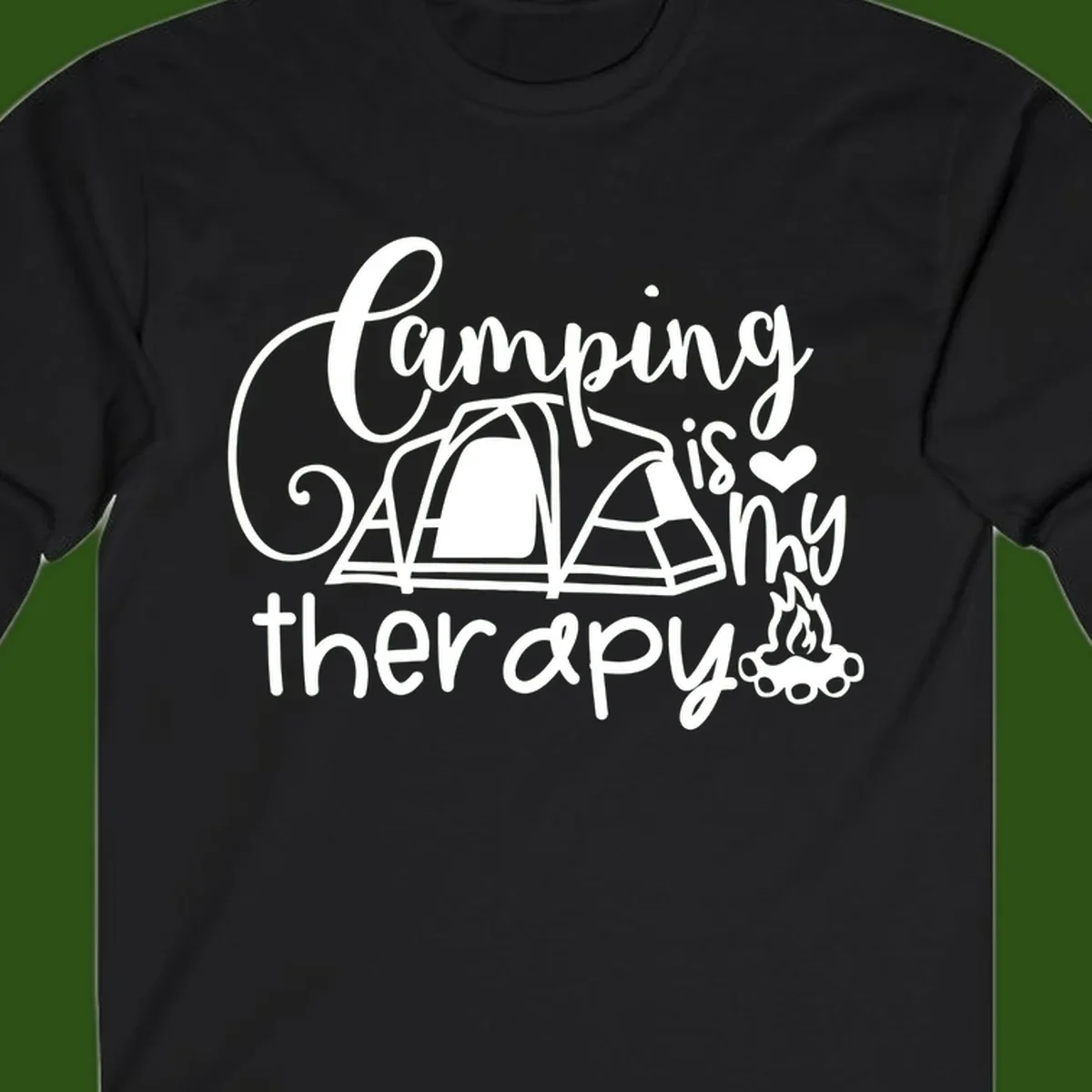 White lettered design reading 'Camping is Therapy' with heart symbol, tent, and campfire illustration on gray background