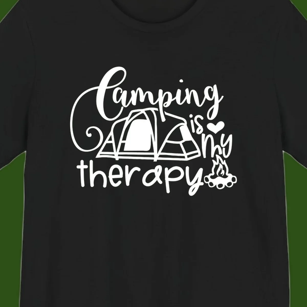 White lettered design reading 'Camping is Therapy' with heart symbol, tent, and campfire illustration on gray background