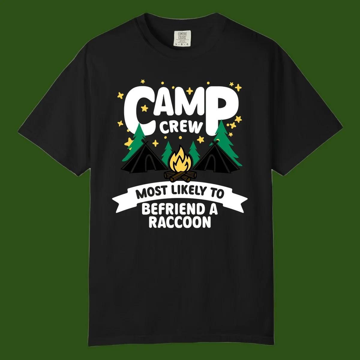 Camp crew raccoon design: campfire with teepees and trees, text reads 'Most Likely To Befriend A Raccoon'