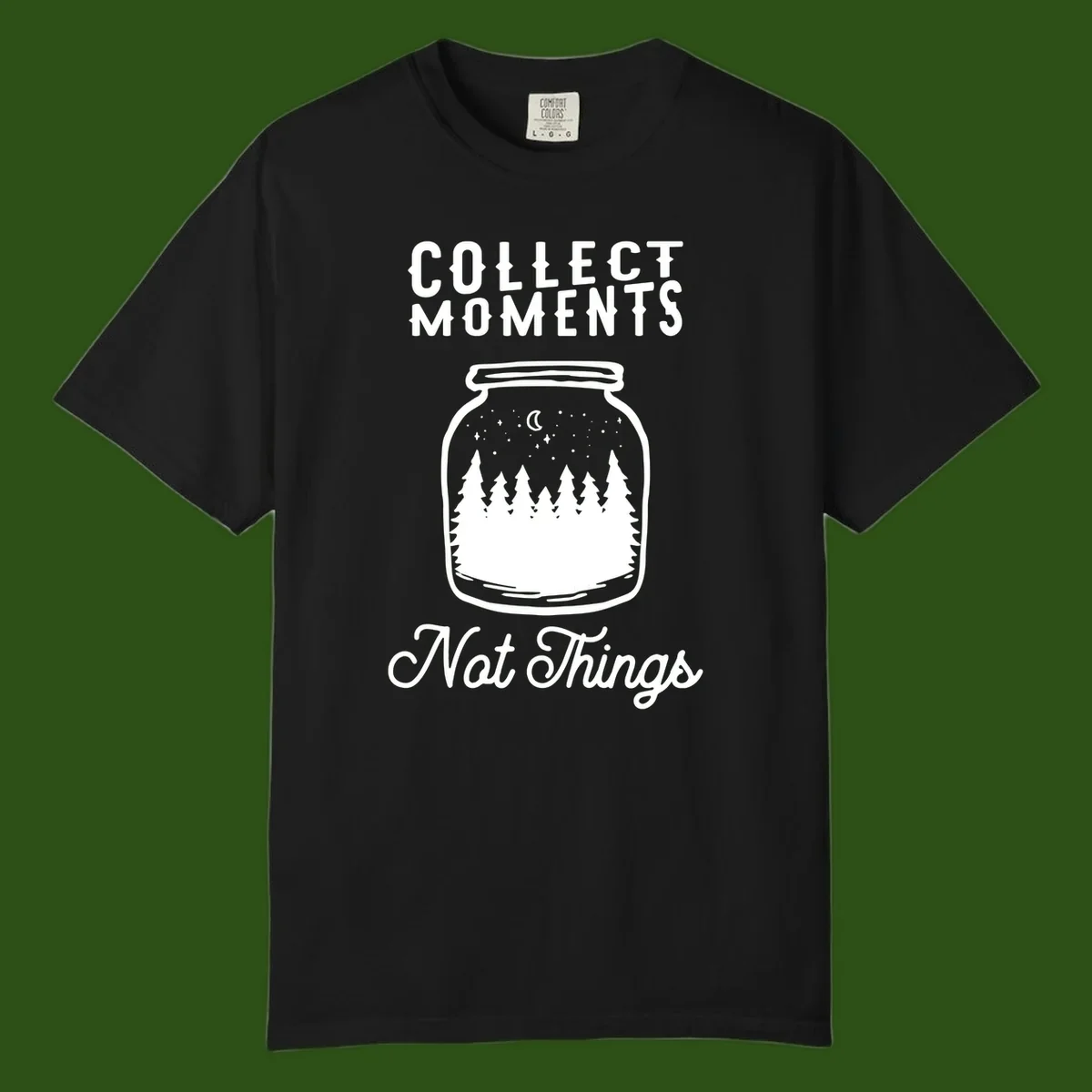 White illustrated mason jar filled with evergreen forest, moon, and stars with text 'Collect Moments Not Things' for camping enthusiasts