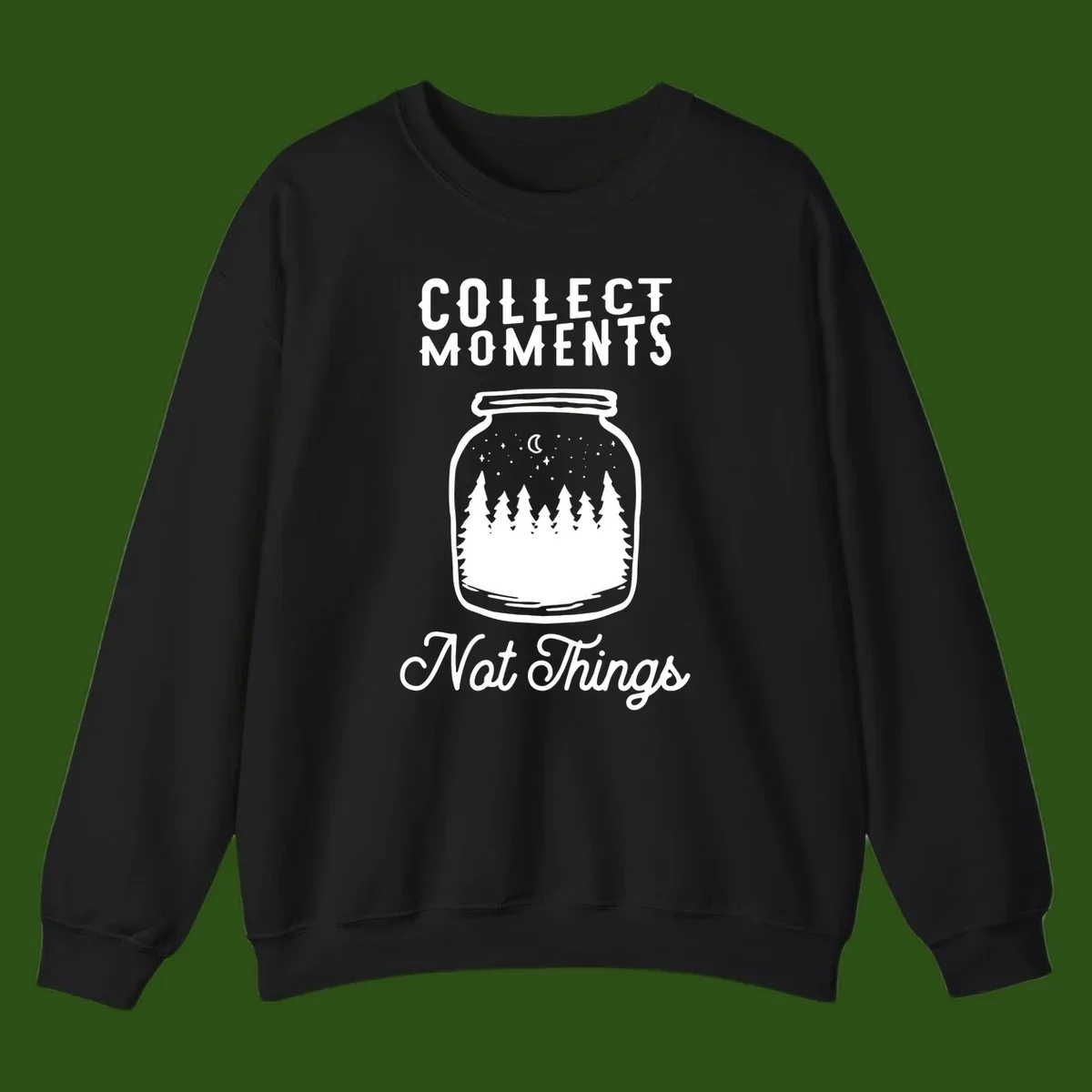 White illustrated mason jar filled with evergreen forest, moon, and stars with text 'Collect Moments Not Things' for camping enthusiasts