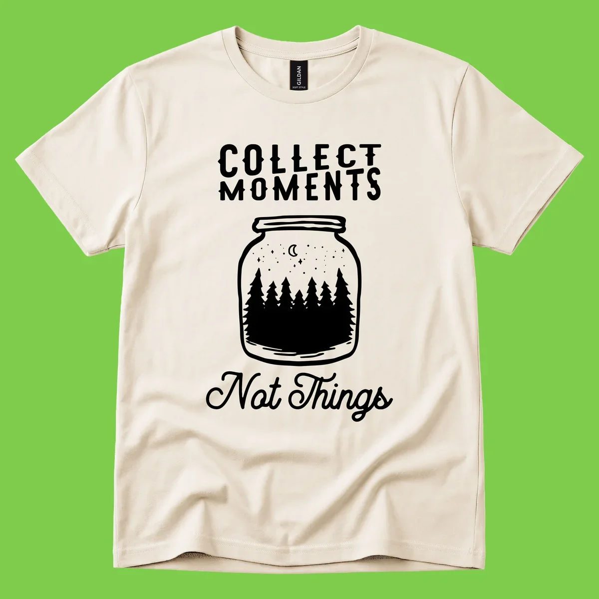 White illustrated mason jar filled with evergreen forest, moon, and stars with text 'Collect Moments Not Things' for camping enthusiasts