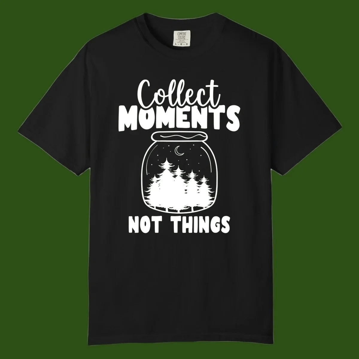 Illustration of a mason jar containing a nighttime forest scene with trees, moon, and stars, with text reading 'Collect Moments Not Things'