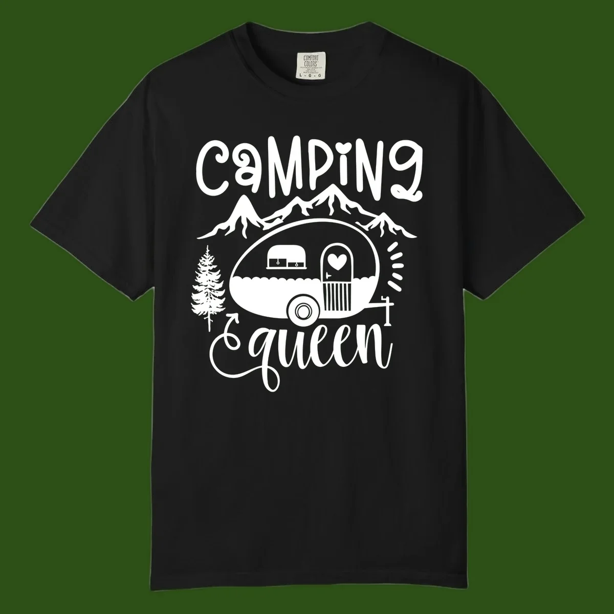 Retro illustration of a vintage Airstream trailer with a heart on the door, surrounded by mountains, trees, and campfire with 'Camping Queen' text