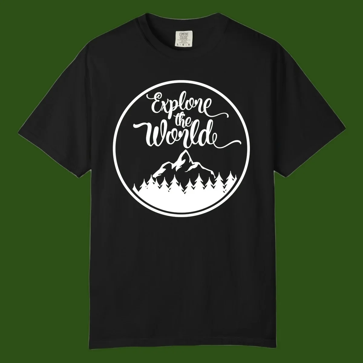White circular badge with 'Explore the World' cursive text above mountain peak and evergreen forest silhouette on gray background