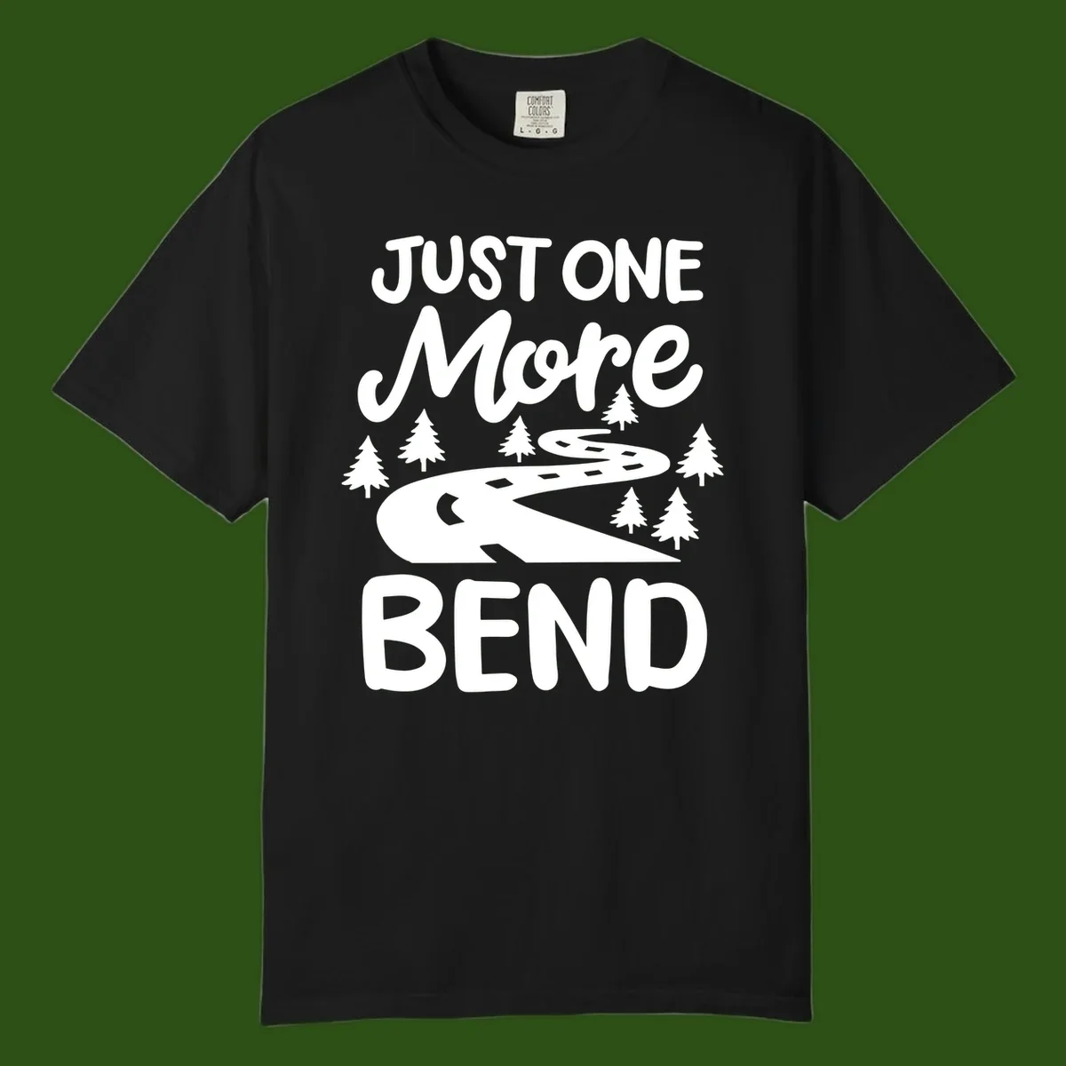 White design on gray background showing a winding road through evergreen trees with cursive text reading 'Just One More Bend'