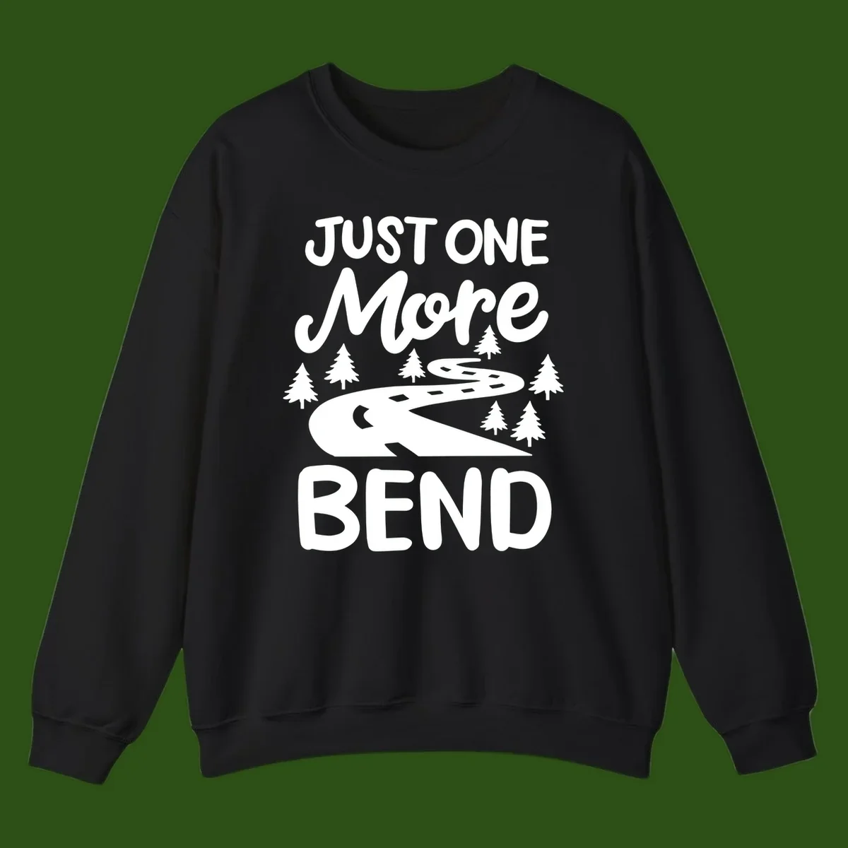 White design on gray background showing a winding road through evergreen trees with cursive text reading 'Just One More Bend'