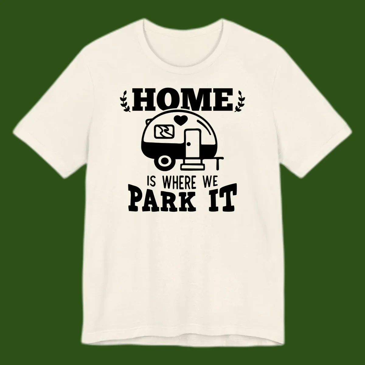 Vintage travel trailer illustration with 'Home Is Where We Park It' text and laurel wreaths on gray background