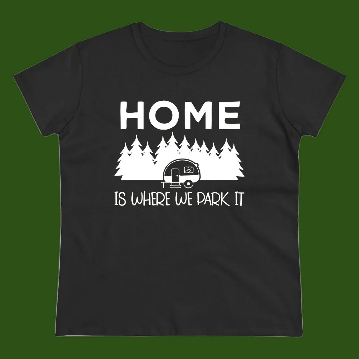 Home is where we park it design with travel trailer and forest trees on gray background