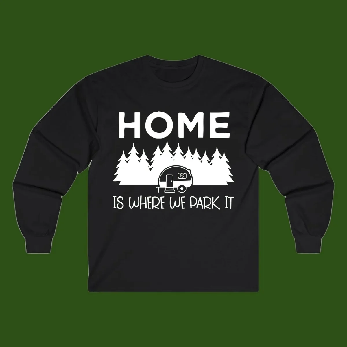 Home is where we park it design with travel trailer and forest trees on gray background
