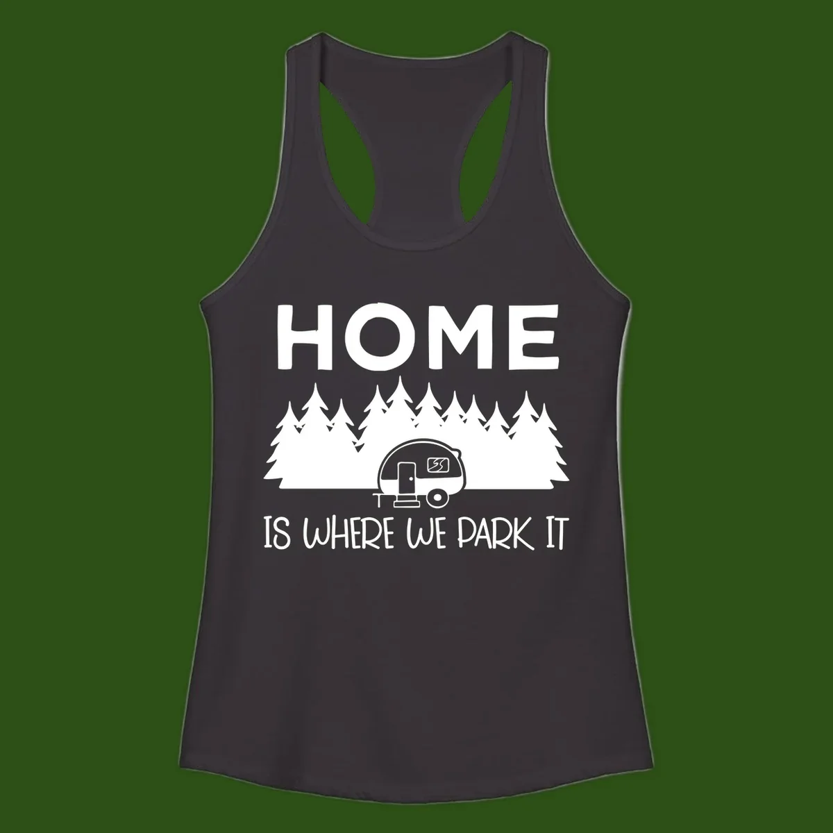 Home is where we park it design with travel trailer and forest trees on gray background