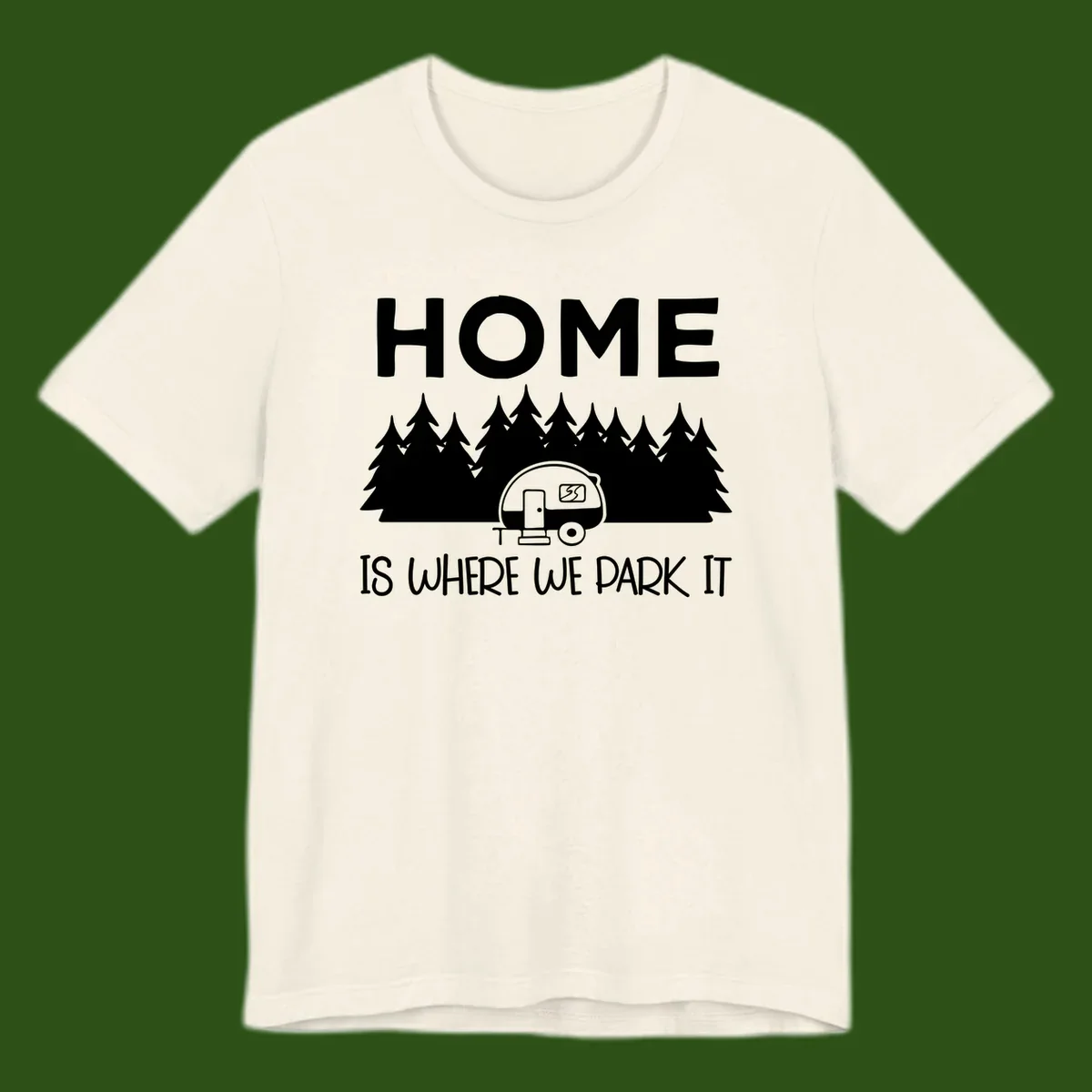 Home is where we park it design with travel trailer and forest trees on gray background
