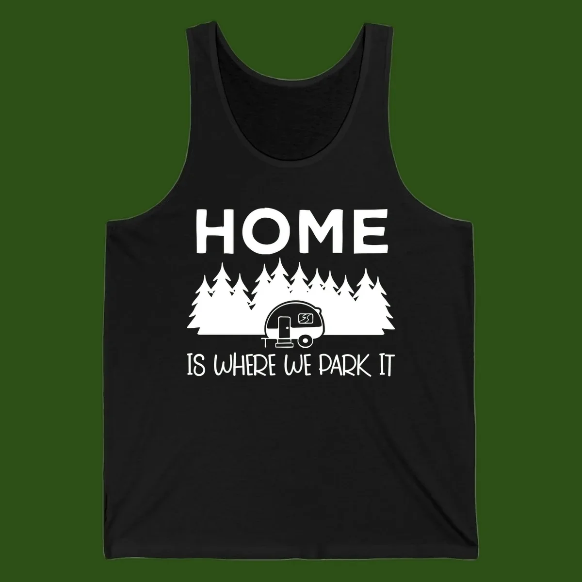 Home is where we park it design with travel trailer and forest trees on gray background