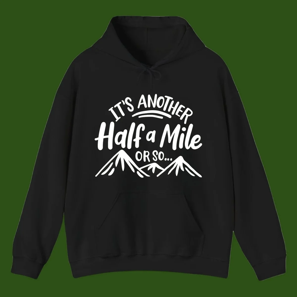 White text reading 'It's Another Half a Mile Or So...' with illustrated snow-capped mountains below on gray background