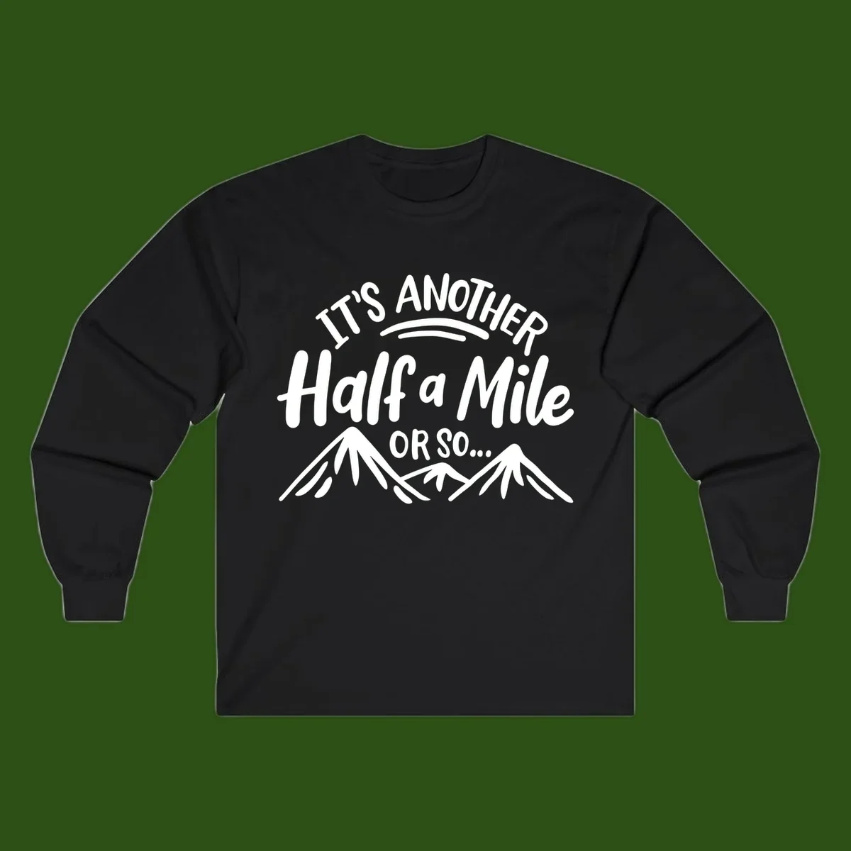 White text reading 'It's Another Half a Mile Or So...' with illustrated snow-capped mountains below on gray background