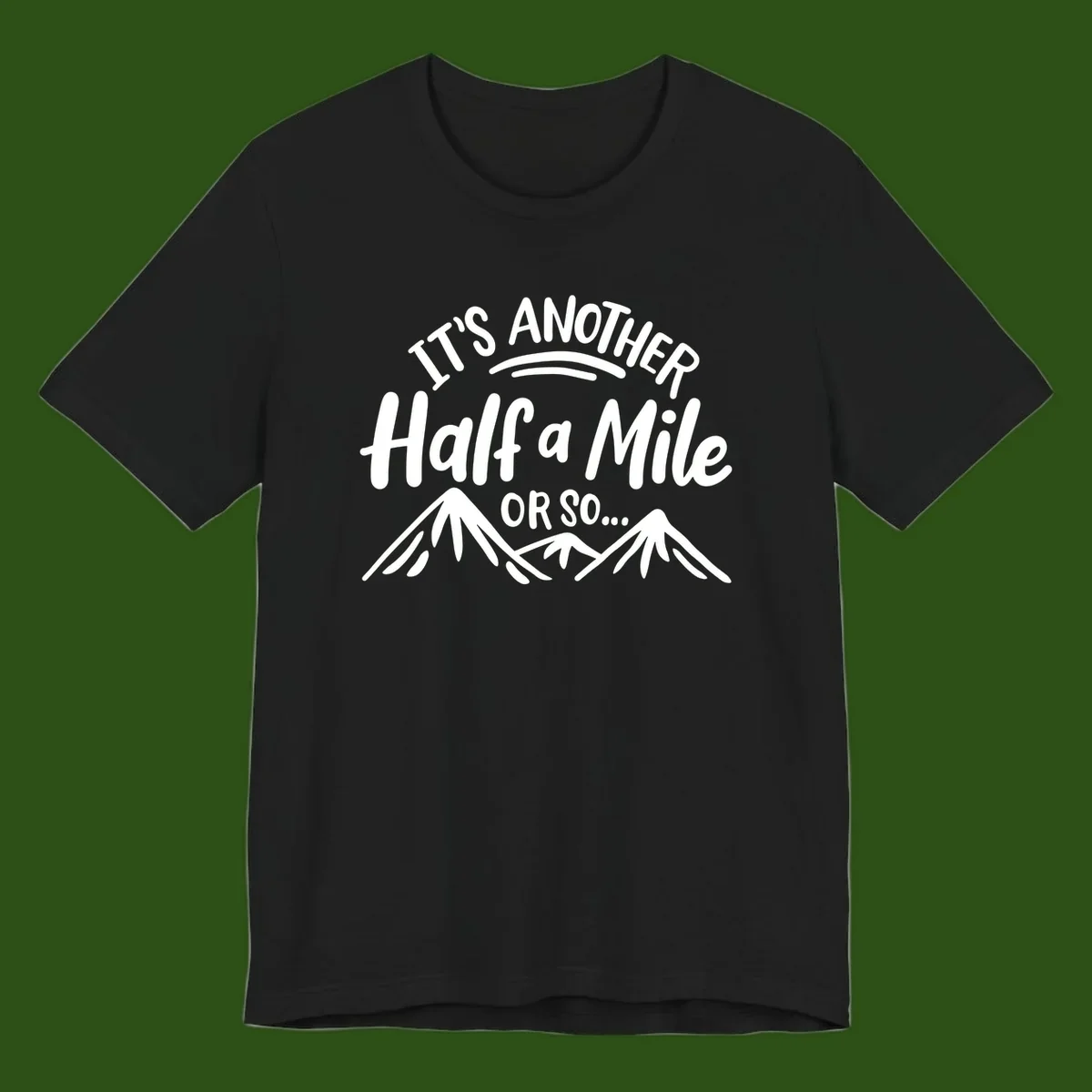 White text reading 'It's Another Half a Mile Or So...' with illustrated snow-capped mountains below on gray background