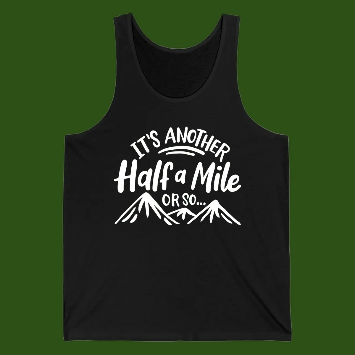 White text reading 'It's Another Half a Mile Or So...' with illustrated snow-capped mountains below on gray background