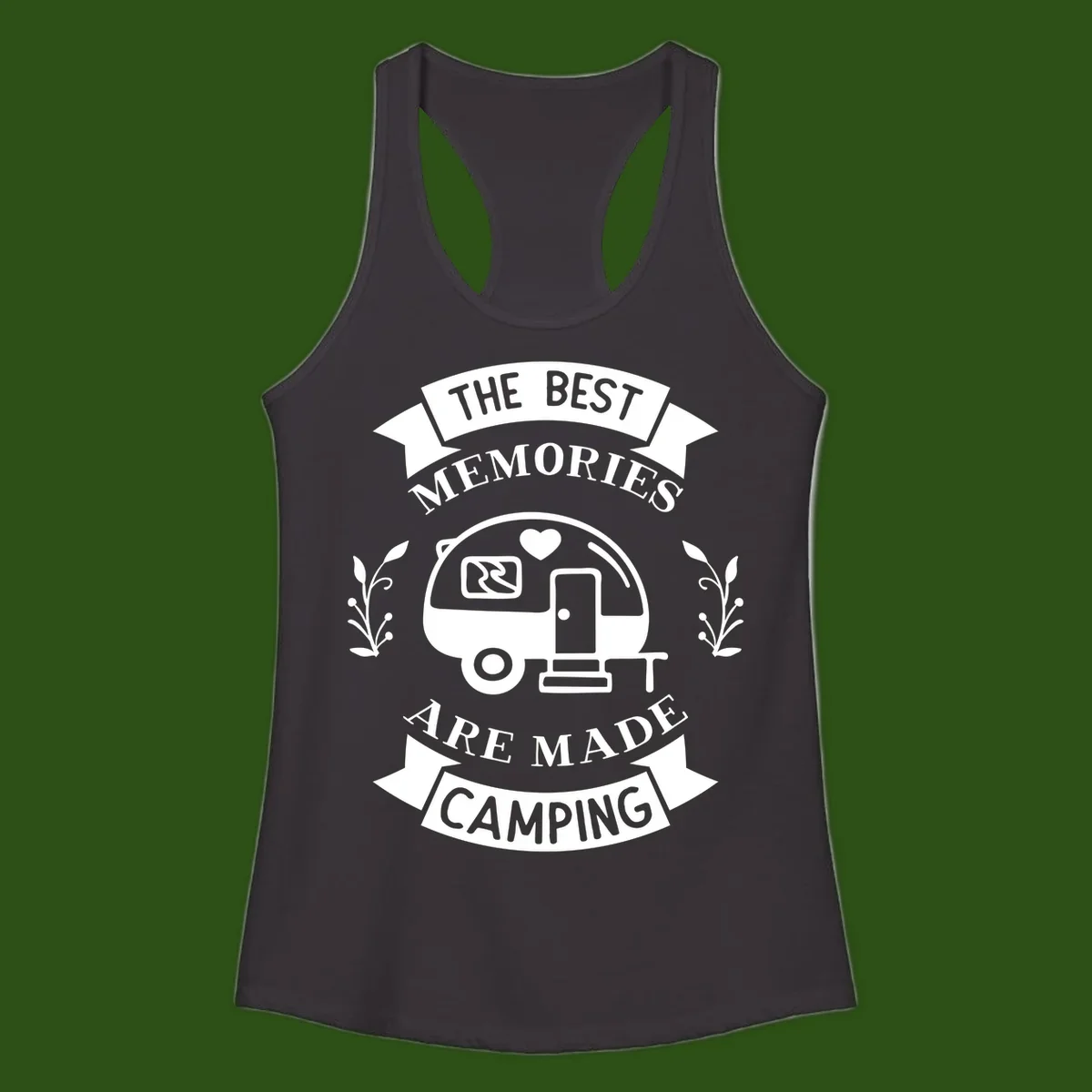Vintage badge design with travel trailer and heart, text reading 'The Best Memories Are Made Camping' with decorative botanical branches