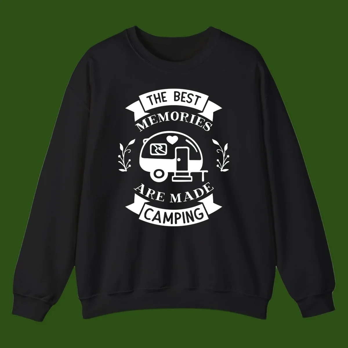 Vintage badge design with travel trailer and heart, text reading 'The Best Memories Are Made Camping' with decorative botanical branches