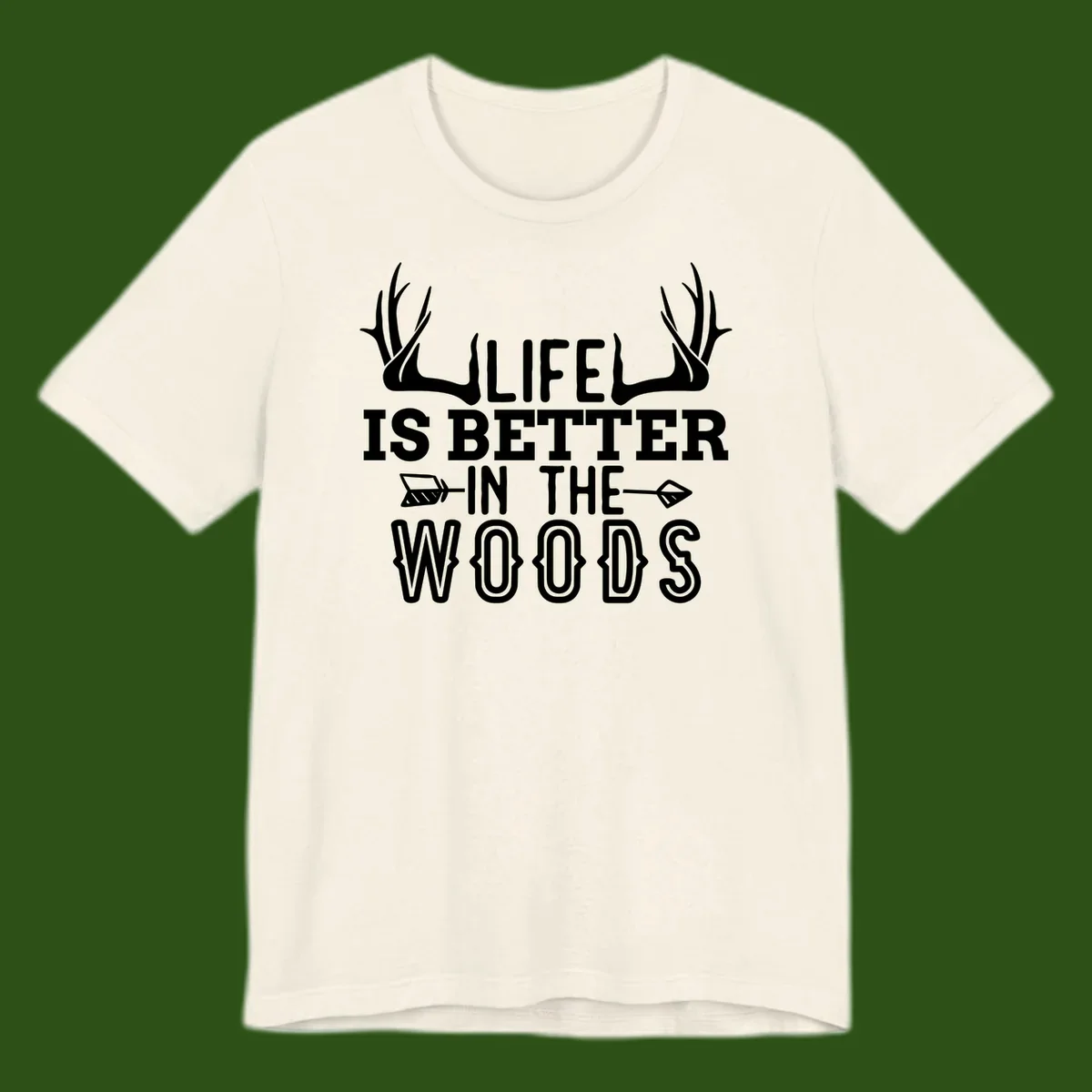 White text reading 'Life Is Better In The Woods' with deer antlers and arrows on gray background