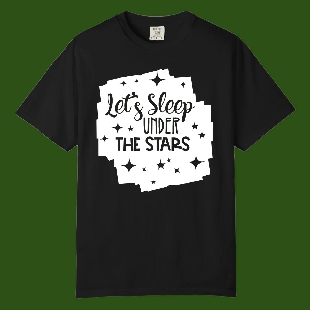 Whimsical design with 'Let's Sleep Under The Stars' text surrounded by sparkles and stars, evoking a cozy camping night.