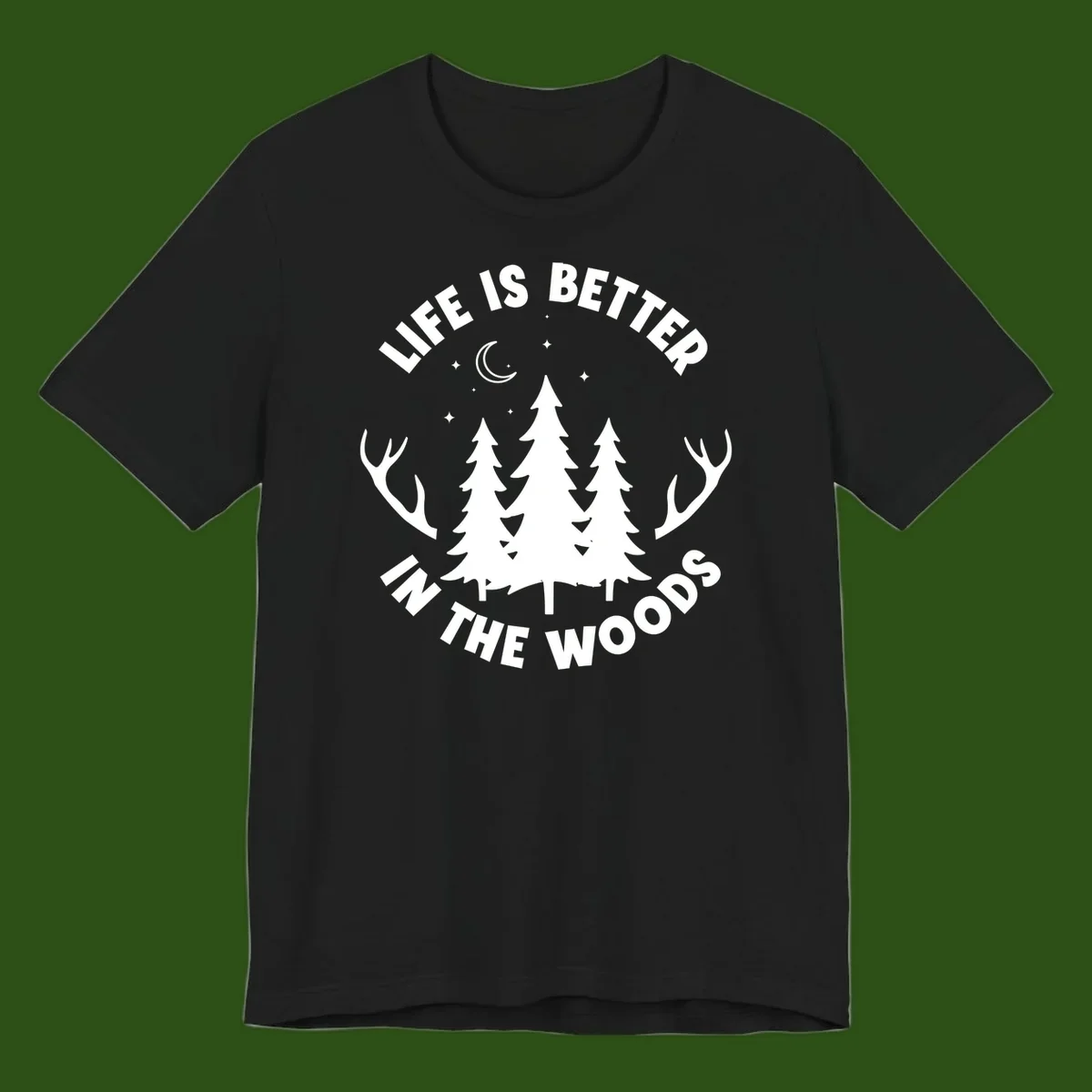 Life is better in the woods design with pine trees, deer antlers, moon and stars on gray background