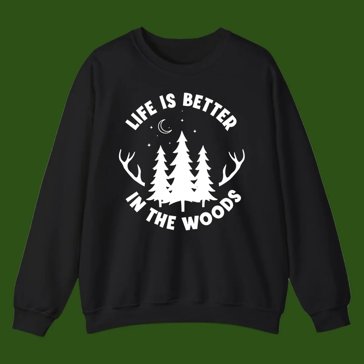 Life is better in the woods design with pine trees, deer antlers, moon and stars on gray background