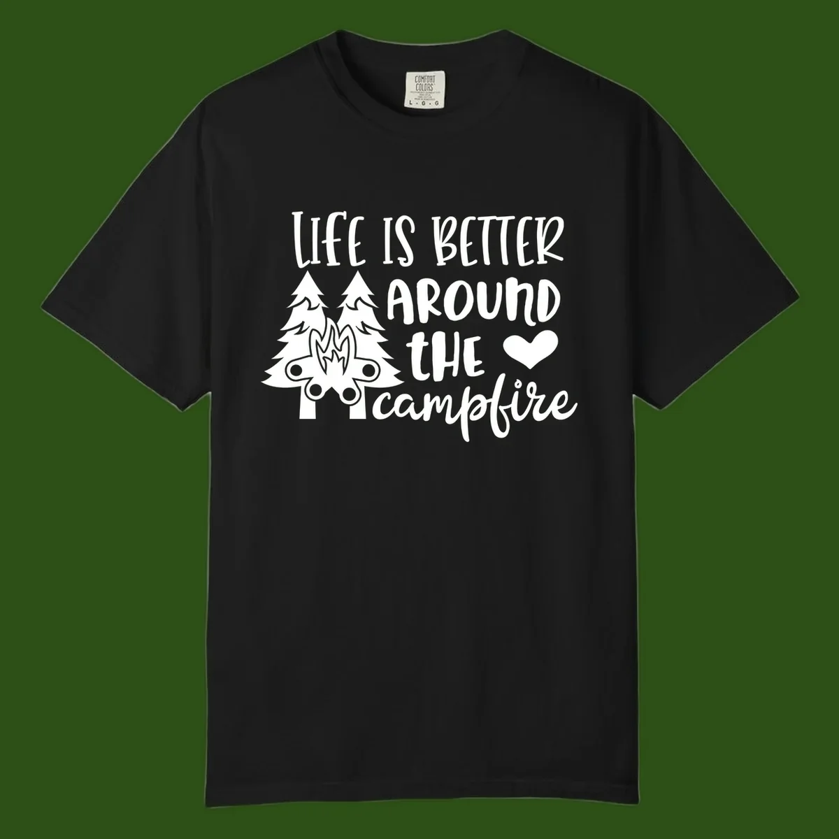 Hand-lettered design with pine trees, campfire, and heart reading 'Life Is Better Around The Campfire' on gray background