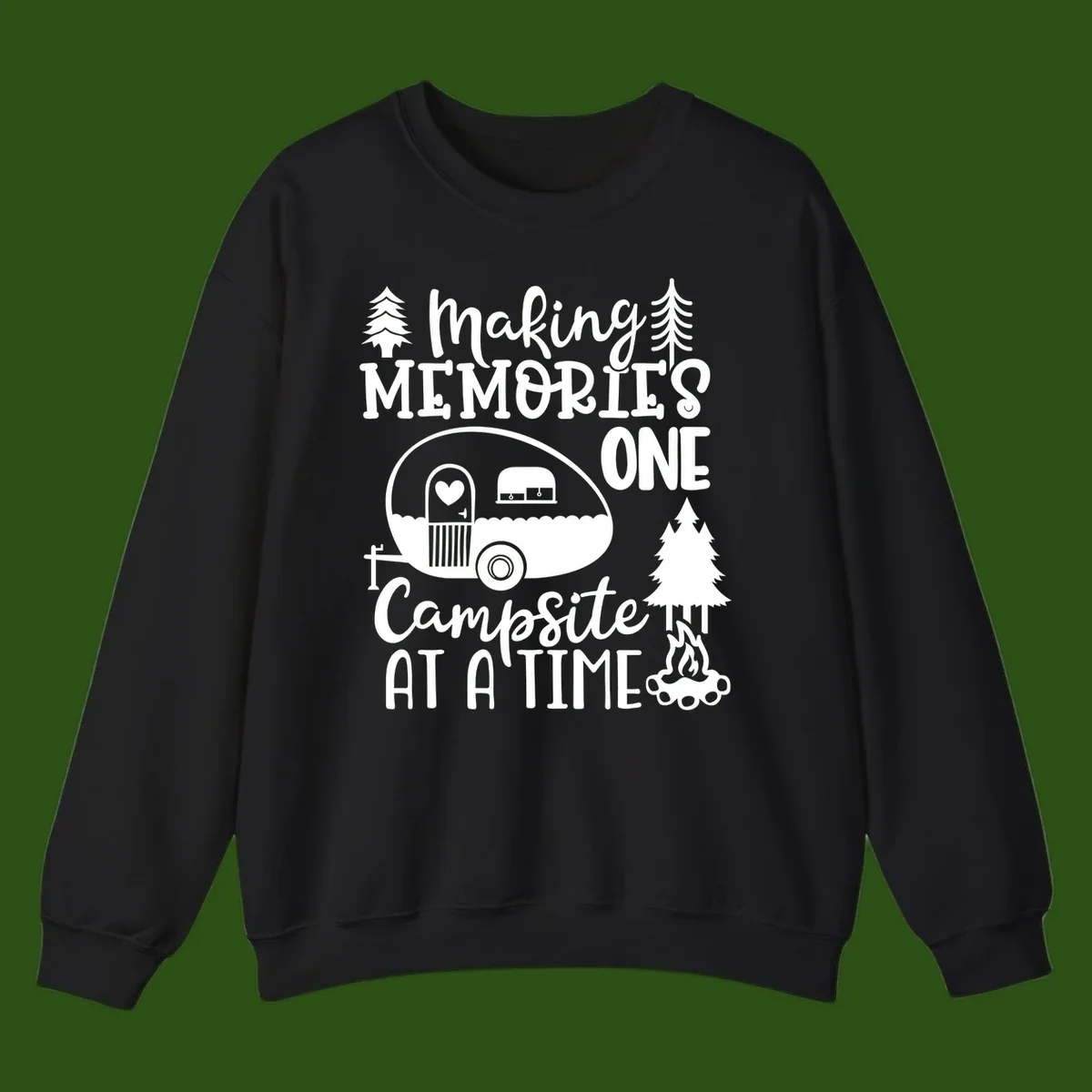 Vintage camper trailer surrounded by pine trees and campfire with 'Making Memories One Campsite At A Time' text