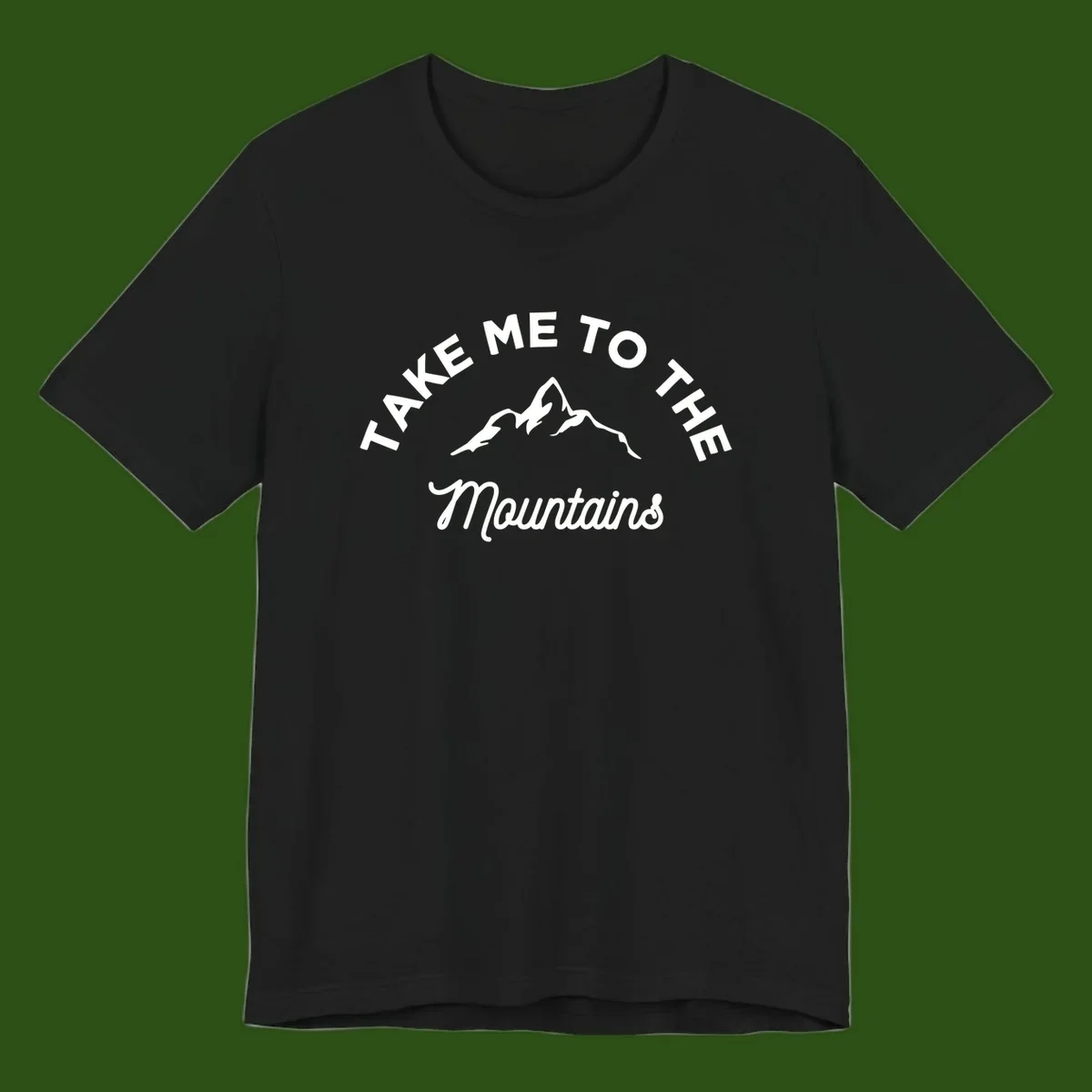 White mountain silhouette with curved text reading 'Take Me To The Mountains' on gray background