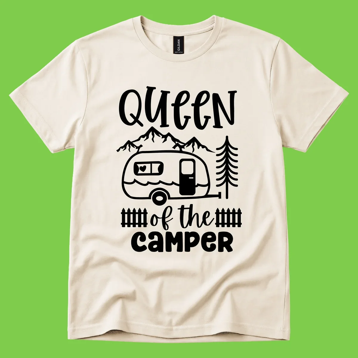 Queen of the Camper design featuring vintage trailer, mountains, and evergreen trees with bold text