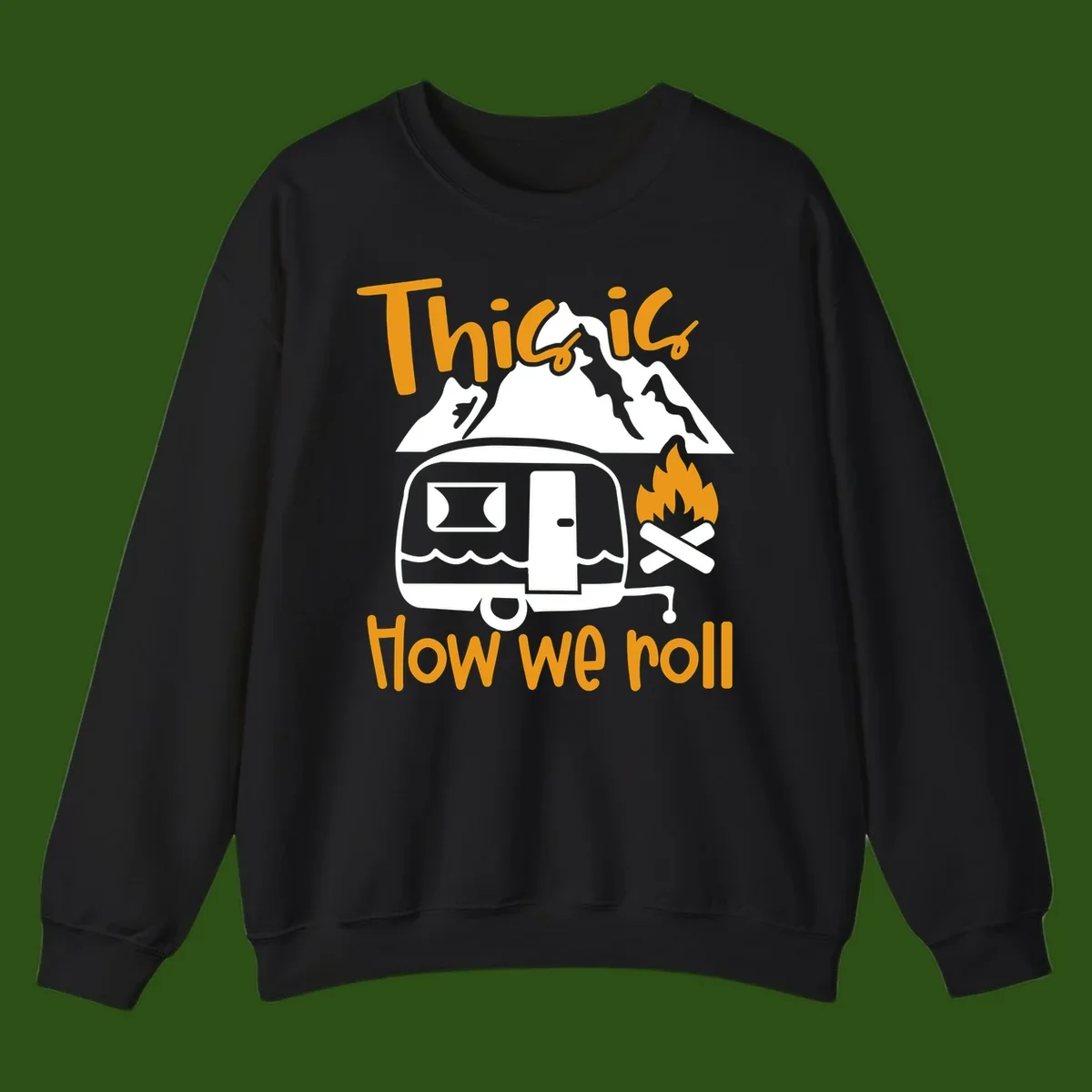 Vintage travel trailer with campfire and mountains, text reads 'This is how we roll' - camping lifestyle illustration