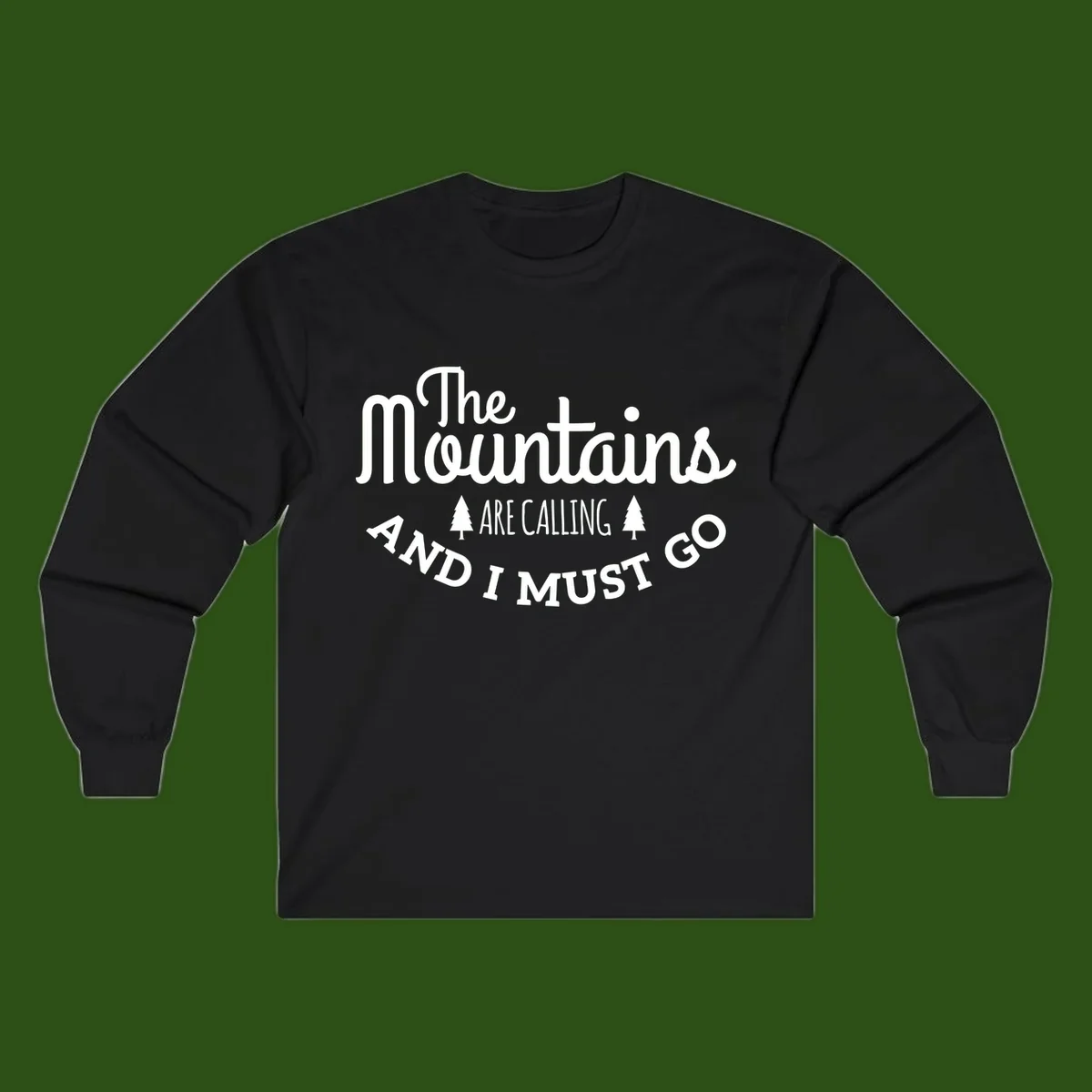 White text reading "The Mountains Are Calling And I Must Go" with pine trees on gray background