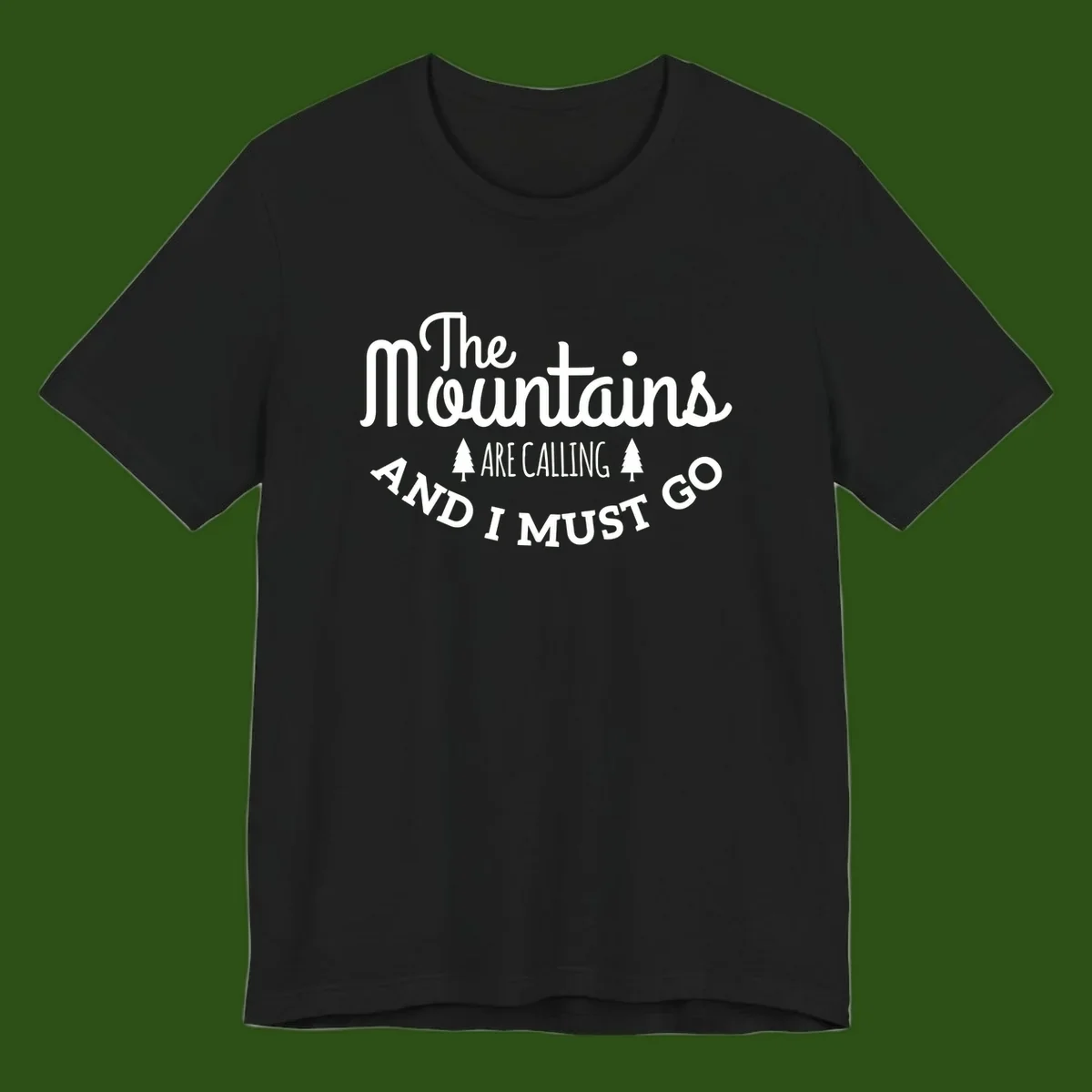 White text reading "The Mountains Are Calling And I Must Go" with pine trees on gray background