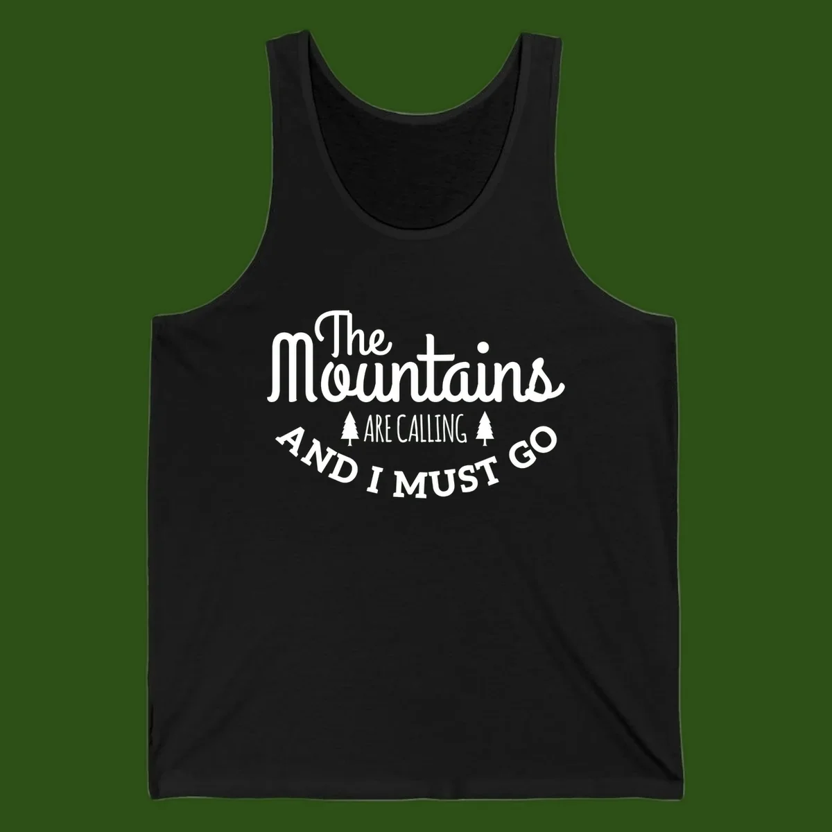 White text reading "The Mountains Are Calling And I Must Go" with pine trees on gray background