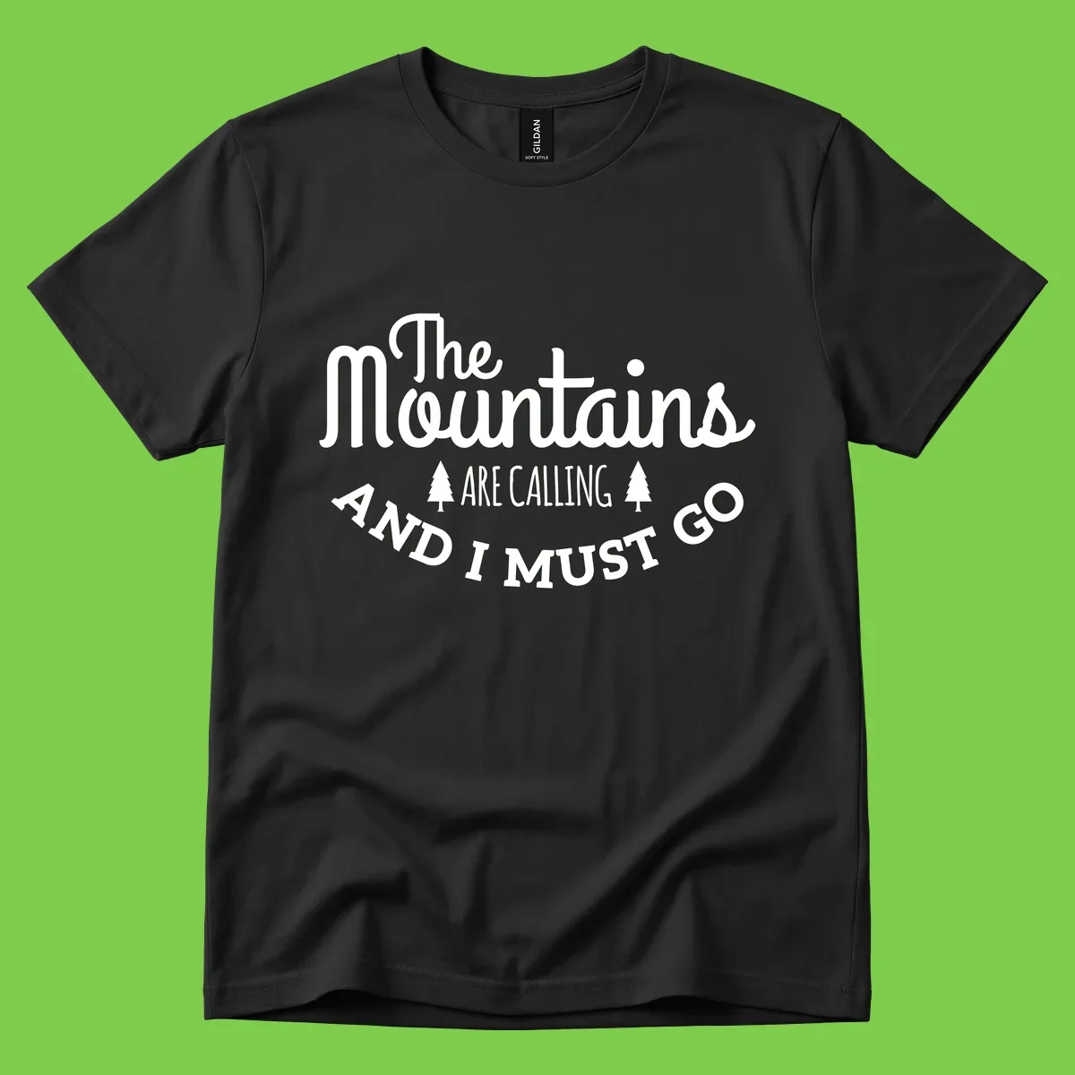 White text reading "The Mountains Are Calling And I Must Go" with pine trees on gray background