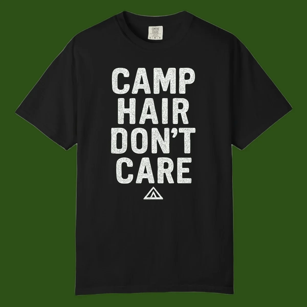 White speckled text reading 'Camp Hair Don't Care' with triangle symbol on gray background