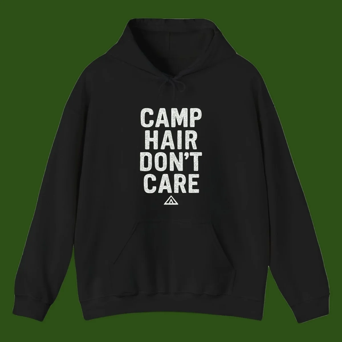 White speckled text reading 'Camp Hair Don't Care' with triangle symbol on gray background