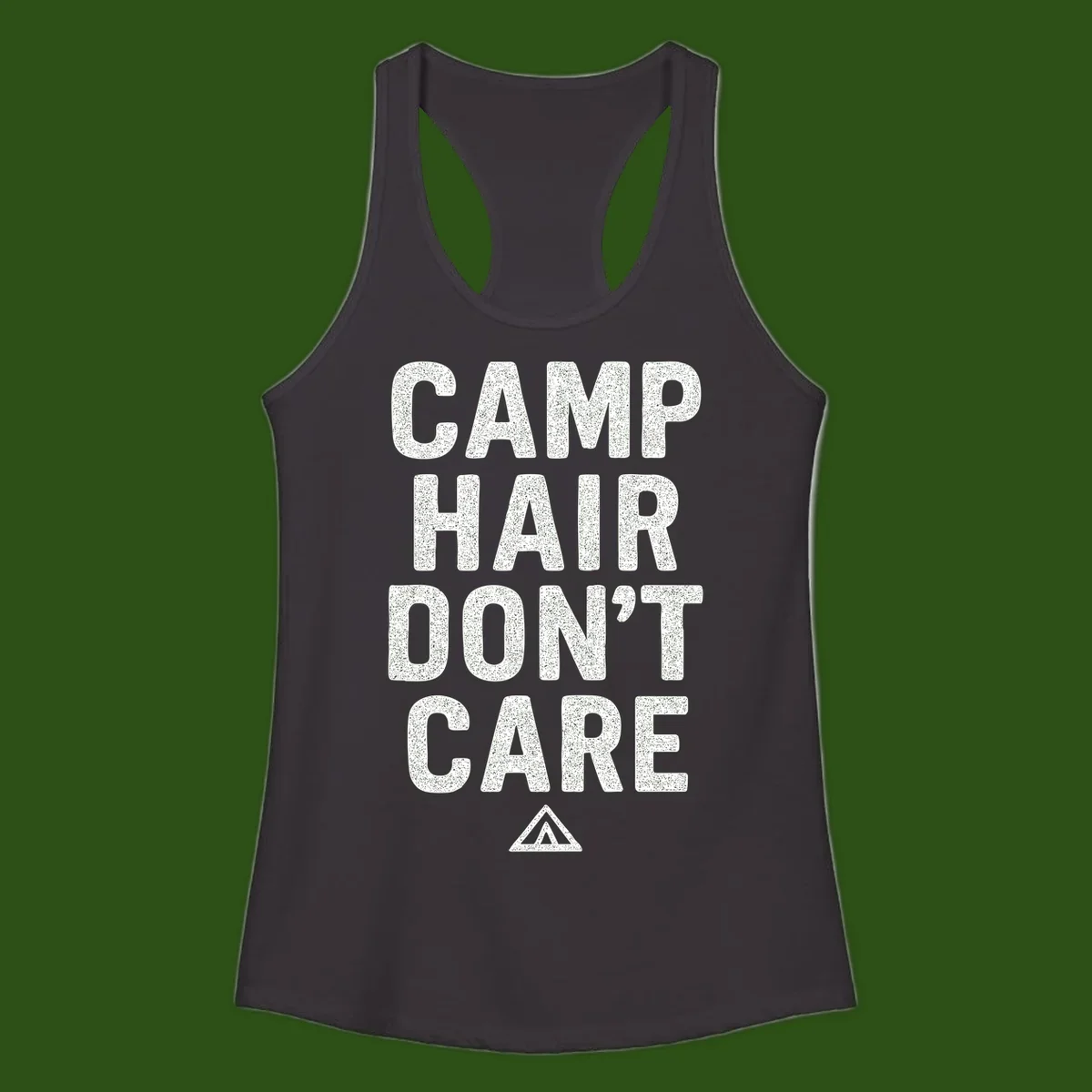 White speckled text reading 'Camp Hair Don't Care' with triangle symbol on gray background
