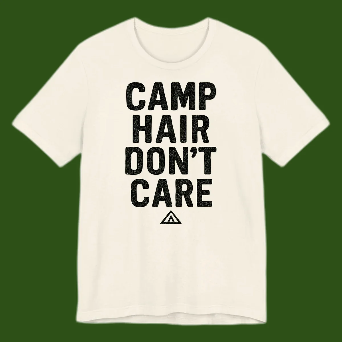 White speckled text reading 'Camp Hair Don't Care' with triangle symbol on gray background
