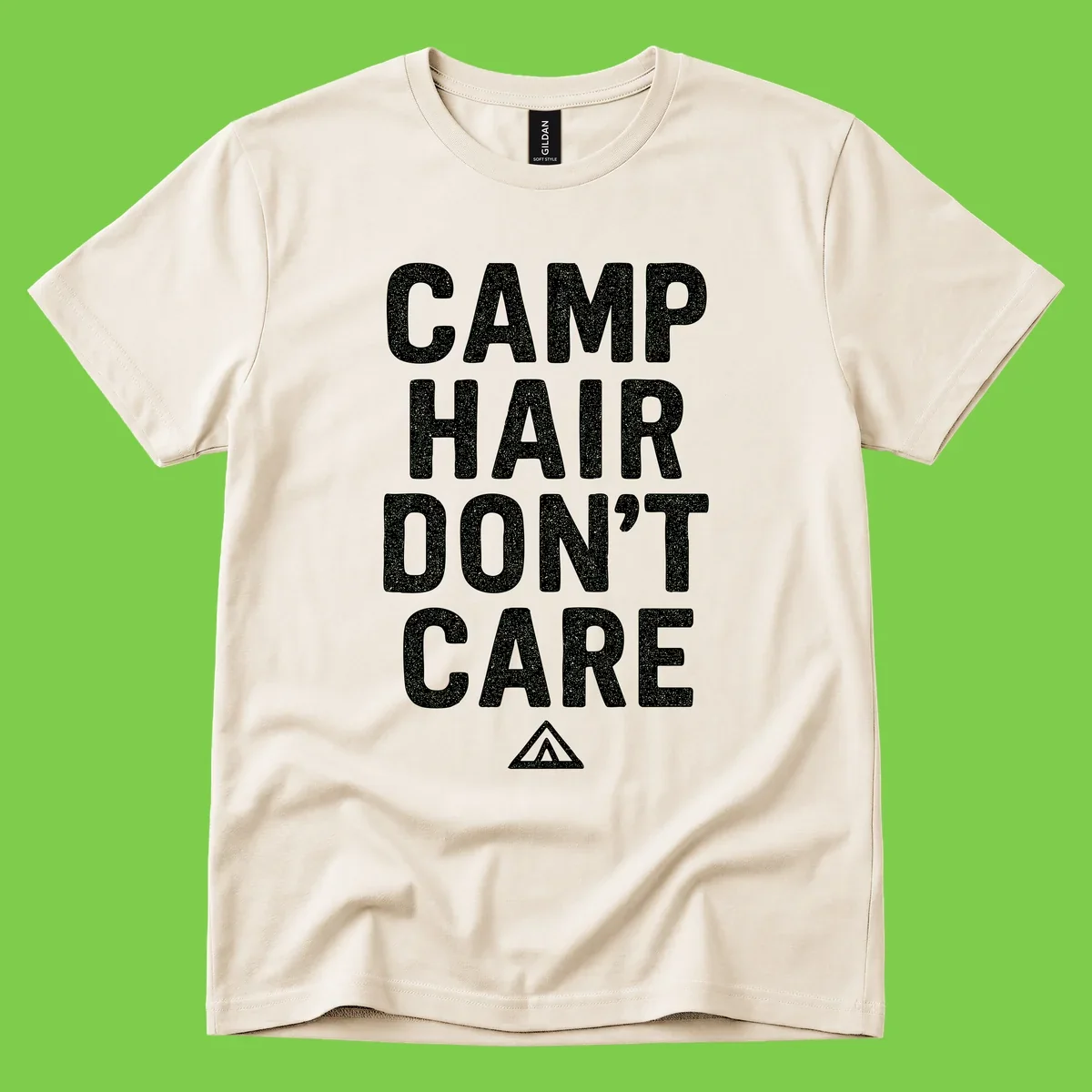 White speckled text reading 'Camp Hair Don't Care' with triangle symbol on gray background