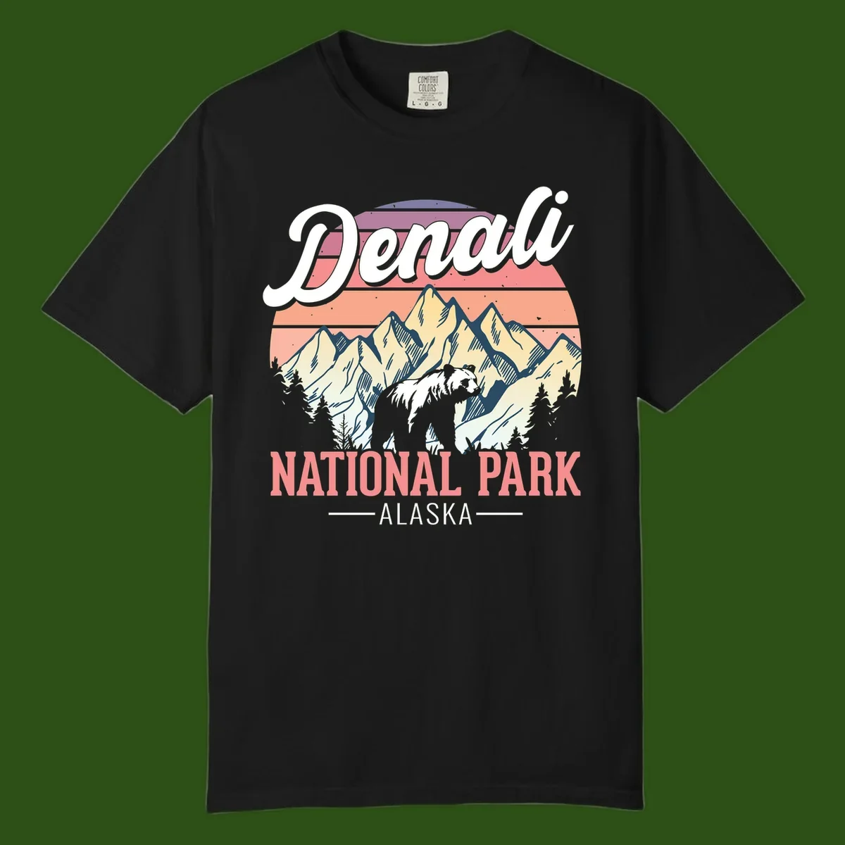 Vintage-style Denali National Park illustration featuring a bear in snowy mountains with retro sunset stripes and evergreen trees