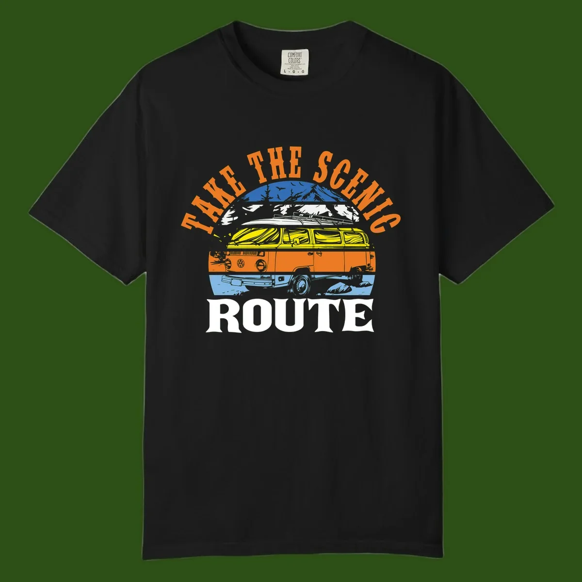 Stacked illustration showing mountain peak, kayak, VW camper bus, and vintage car with 'Hike The Seven Route' text for adventure travel apparel.