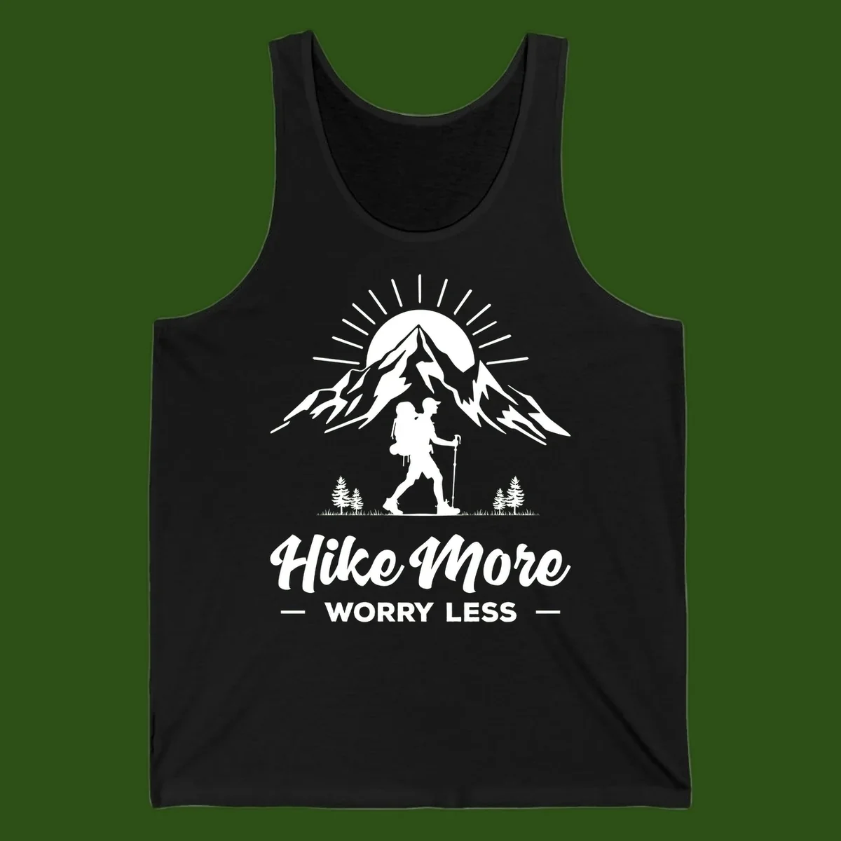 Silhouette of hiker with backpack and poles facing snow-capped mountain with radiating sun, evergreen trees below, text reads 'Hike More Worry Less'