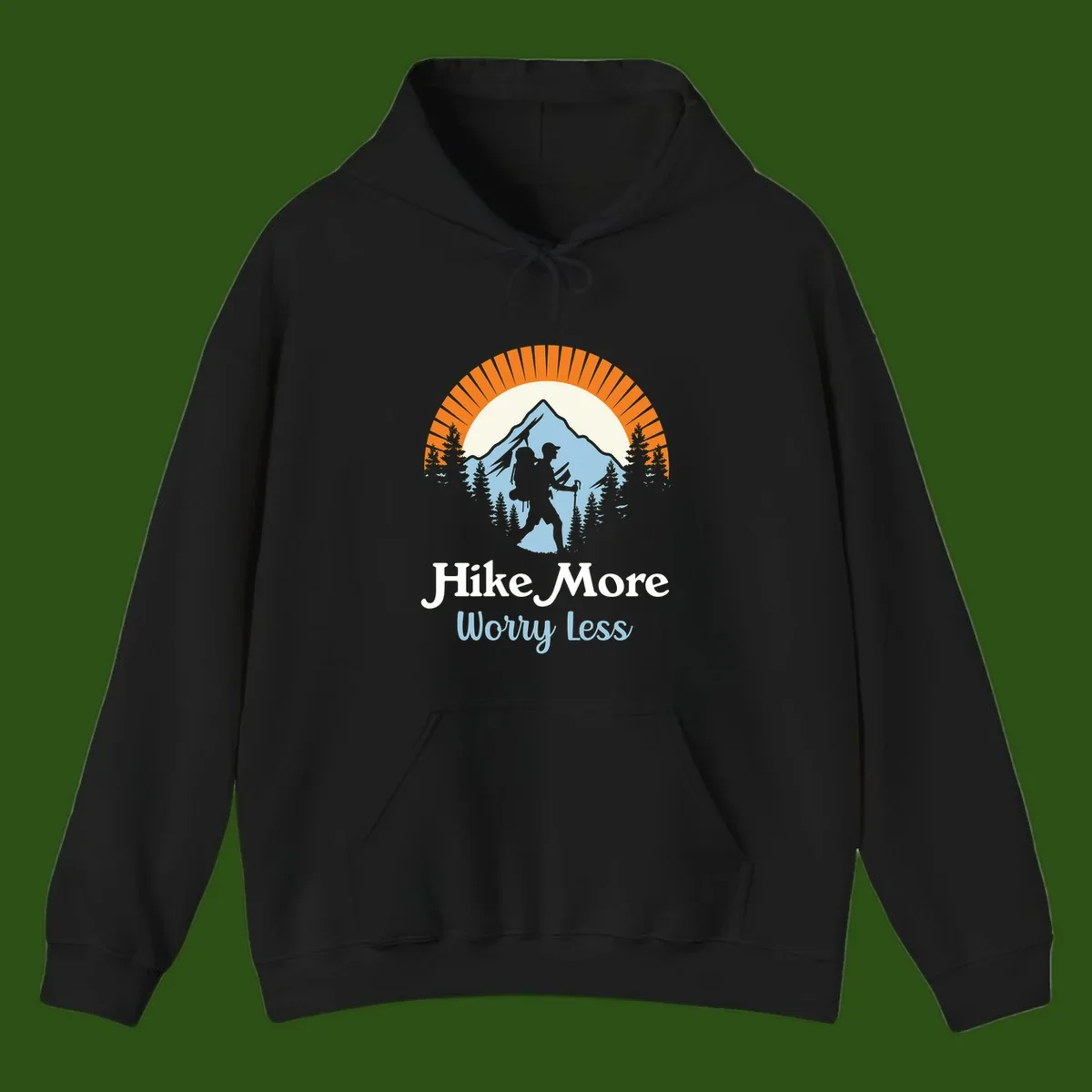 Hike more worry less badge design with silhouetted hiker, mountain peak, and evergreen forest in circular composition.