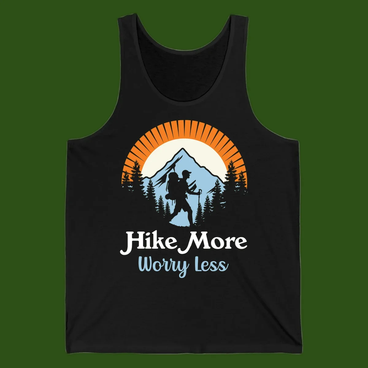 Hike more worry less badge design with silhouetted hiker, mountain peak, and evergreen forest in circular composition.