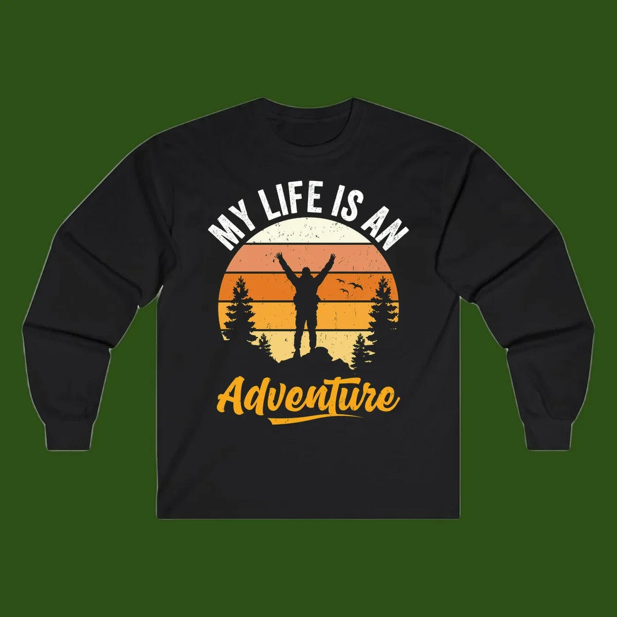 Retro sunset illustration with silhouette of person celebrating arms raised, evergreen trees and mountains, text 'My Life Is An Adventure'